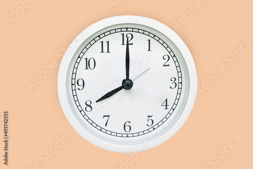 Classic white wall clock 8.00 a.m.