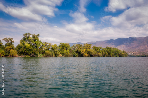 Riverbanks of Grijalva river with low-level vegetation on a beautiful summer day at Chiapa de Corzo, the starting point for the boat trips to Sumidero Canyon, a deep natural canyon in southern Mexico. © Daniela Photography