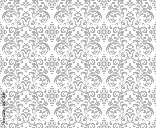 Wallpaper in the style of Baroque. Seamless vector background. White and gray floral ornament. Graphic pattern for fabric, wallpaper, packaging. Ornate Damask flower ornament.