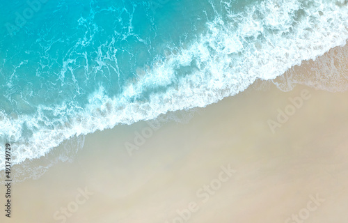 Aerial top view of tropical beach with the transparent Caribbean sea and the blue sky in the background