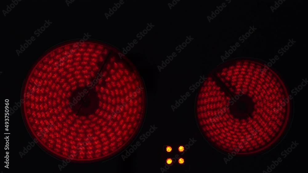 Top view, electric stove, ceramic hob. Heating up the coils, turning on the electric stove