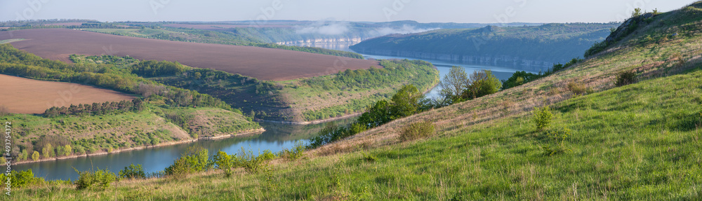 Amazing spring view on the Dnister River Canyon with picturesque rocks, fields, flowers. This place named Shyshkovi Gorby,  Nahoriany, Chernivtsi region, Ukraine.