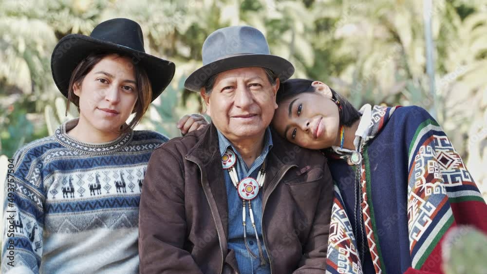 Latin American Indigenous Quechua Senior Father with two young sister ...