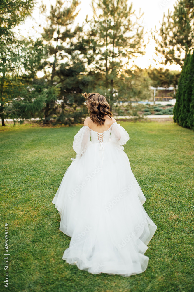 Beautiful wedding bride running in the garden Beautiful wedding bride running in the garden