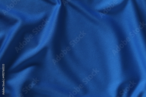 Blue fabric waves background texture/close up of a textile background photo