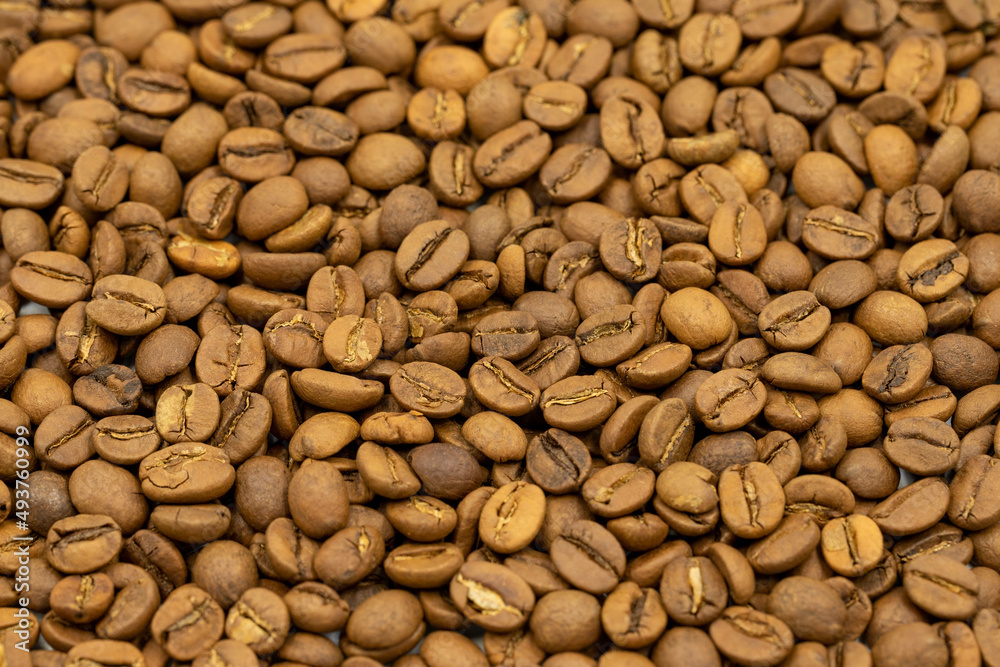 Coffee beans background. Close up of roasted coffee beans