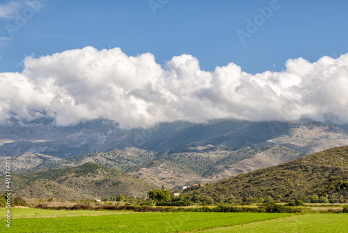 Beautiful mountain valley with gentle hills and agricultutal filds