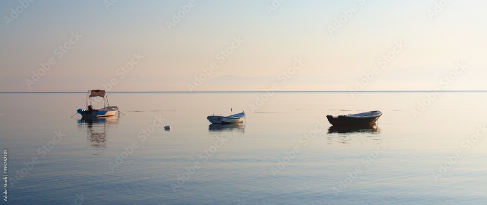 Fishing boats in the resort of Moraitika on the shores of the Ionian Sea on the island of Corfu in Greece. Fishing boats in the resort of Moraitika on the shores of the Ionian Sea on the island of Corfu in Greece.