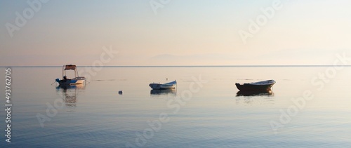 Fishing boats in the resort of Moraitika on the shores of the Ionian Sea on the island of Corfu in Greece. © Pavel