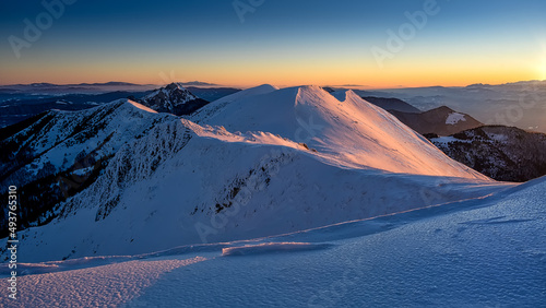 view of Chleb in Mala Fatra on snowy slopes during sunrise,beautiful Slovak unspoilt nature, a wonderful destination for vacation and relaxation