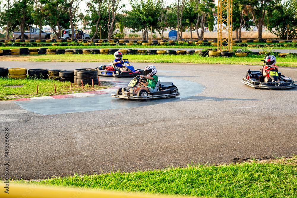 Go Kart kids driving training and racing in provocative style.  