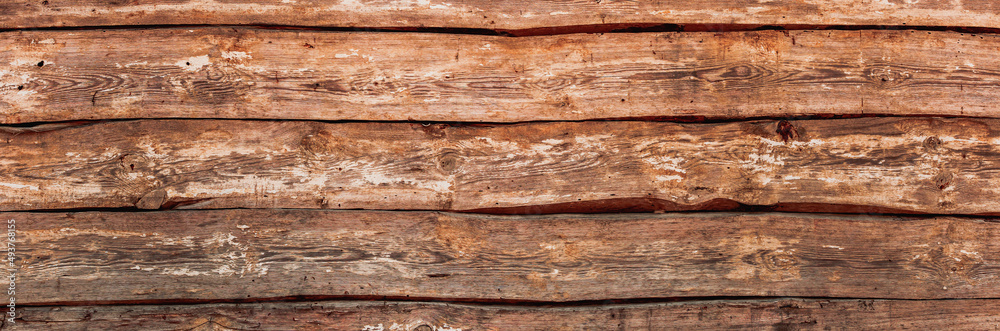 Obraz premium Naturalne tło niejednolitych starych grubych drewnianych desek z teksturą korozji drewna.. Kolory brązu. Tapeta.