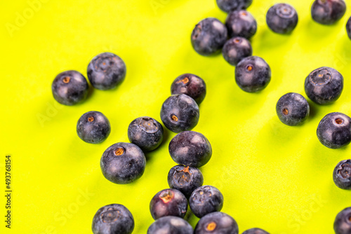 fresh blueberries on yellow  background