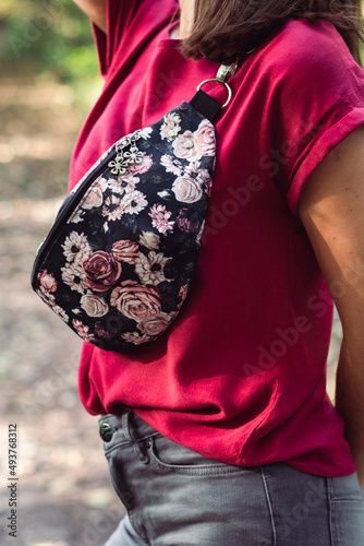 Woman posing with a flower boombag in a forest, clothes, style, accessories