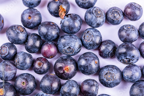 fresh blueberries on yellow background