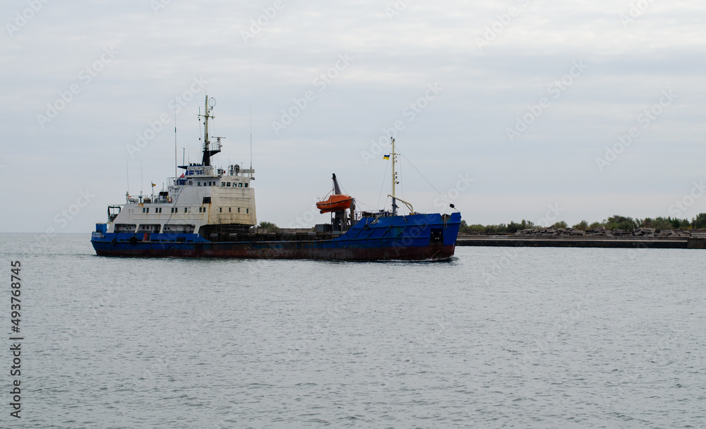 Sea tug. Boat for towing ships. The boat patrols the river. Sea port.