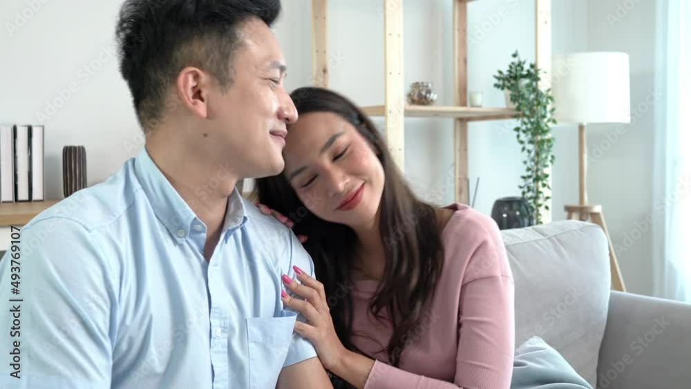 Happy asian female lying on her boyfriend’s laps with a smiling face to enjoy and happy with gentle touch on the hair on sofa in the living room at home ,concept trust couples love
Happy asian female lying on her boyfriend’s laps with a smiling face to enjoy and happy with gentle touch on the hair on sofa in the living room at home ,concept trust couples love