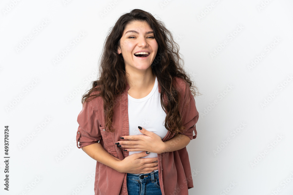 Teenager Russian girl isolated on white background smiling a lot Teenager Russian girl isolated on white background smiling a lot