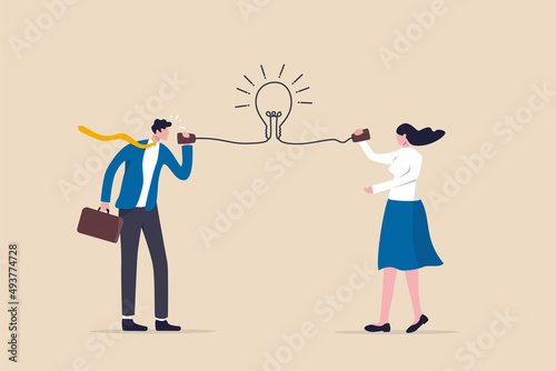 Communicate idea, advice or solution, good communication skill for business success, brainstorm or discuss in meeting concept, smart businessman talk to colleague on phone line with lightbulb symbol. photo