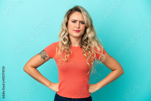 Young Brazilian woman isolated on blue background angry © luismolinero