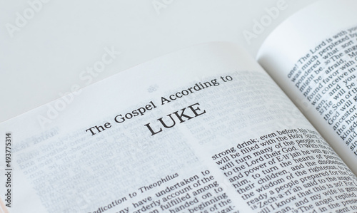 Luke Gospel from Holy Bible Book inspired by God and Jesus Christ, a closeup. New Testament Scripture isolated on a white background. photo