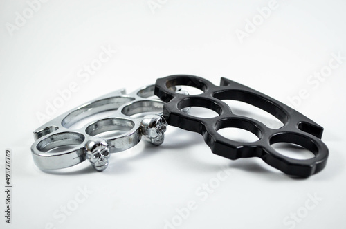 Two Brass Knuckles On The Isolated White Background