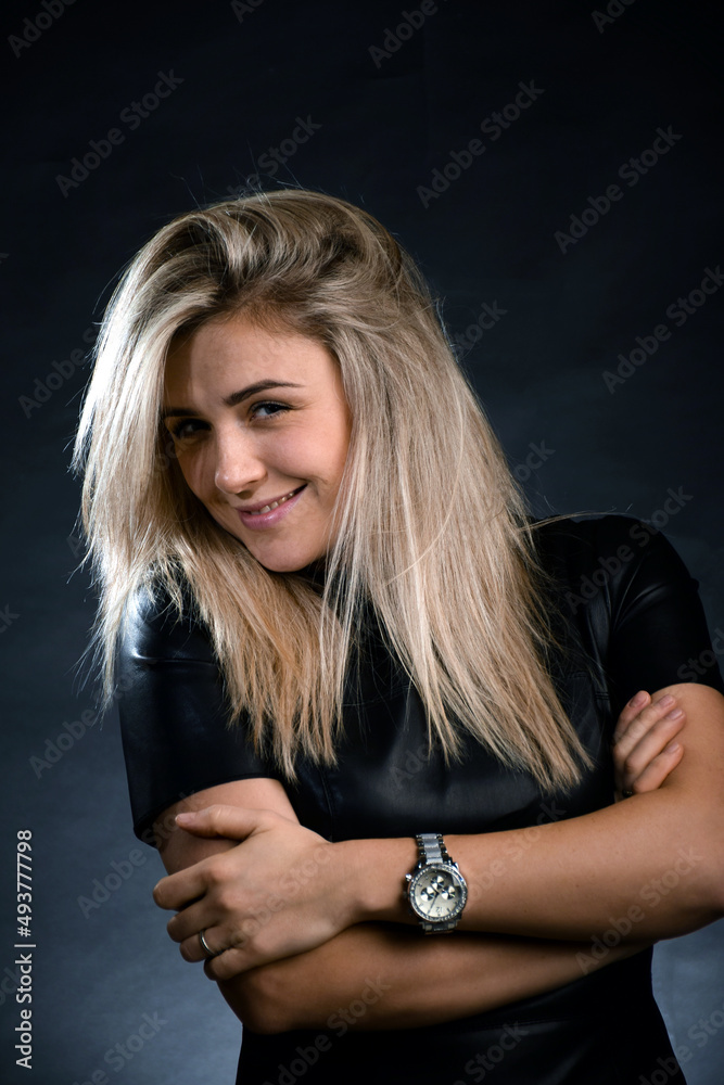 Young Caucasian blonde woman looking at camera and smiling white-toothed smile Young Caucasian blonde woman looking at camera and smiling white-toothed smile