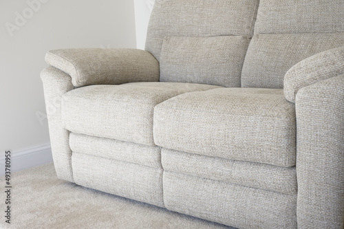 Neutral colour home interior showing sofa and carpet