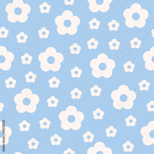 Abstract seamless pattern with white vintage groovy daisy flowers on blue background. Retro vector background in style 60s, 70s