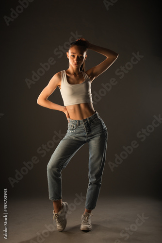 Posing while touching her hair