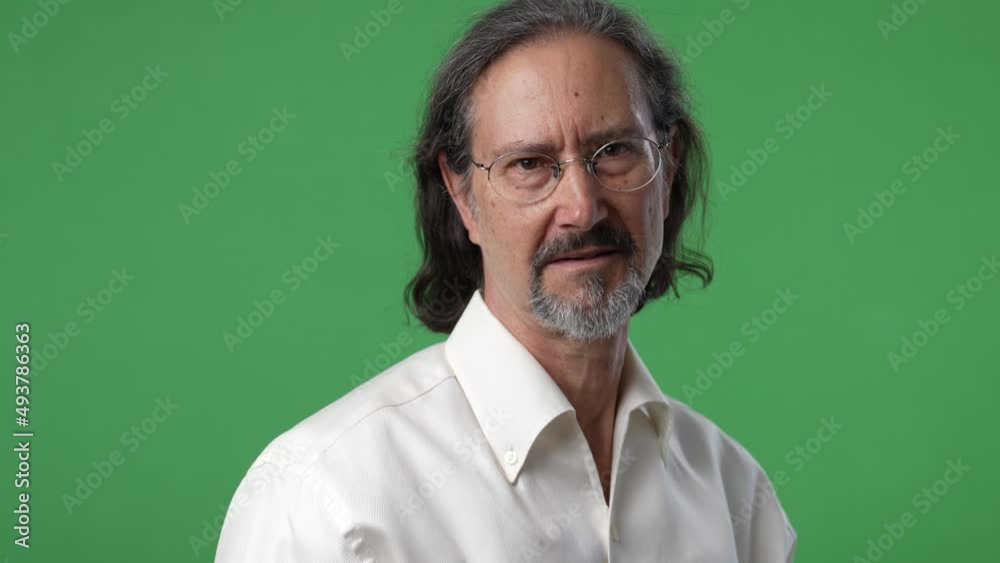 Portrait of mature man smiling happy face on green screen chroma key background in business shirt. Portrait of mature man smiling happy face on green screen chroma key background in business shirt.