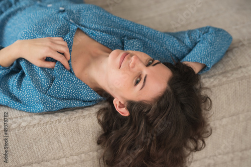 beautiful brunette adult girl in femine pajamas sleep wear homewear at home lifestyle photo