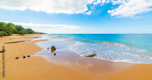 Golden sand and blue sea in La Perle beach in Guadeloupe photo