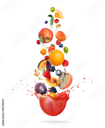 Tablou pe pânză Different fruits and berries are falling in splashes of juice on a white backgro