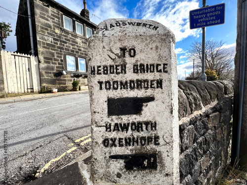 19th century stone, Hebden Bridge and Haworth road sign near, Pecket Well. Hebden Bridge, UK photo
