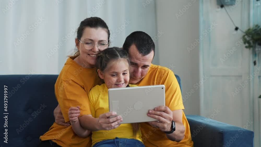 Happy family chatting online. Modern technologies for online school education. Family communicates with doctor.Online communication.Modern technologies of consultation with doctor and school education Happy family chatting online. Modern technologies for online school education. Family communicates with doctor.Online communication.Modern technologies of consultation with doctor and school education