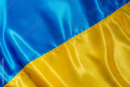 Texture of national satin fabric textile flag of Ukraine