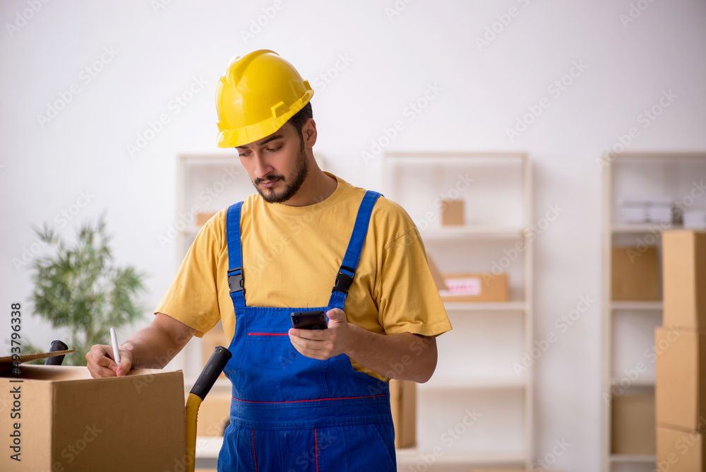 Young male contractor doing home relocation