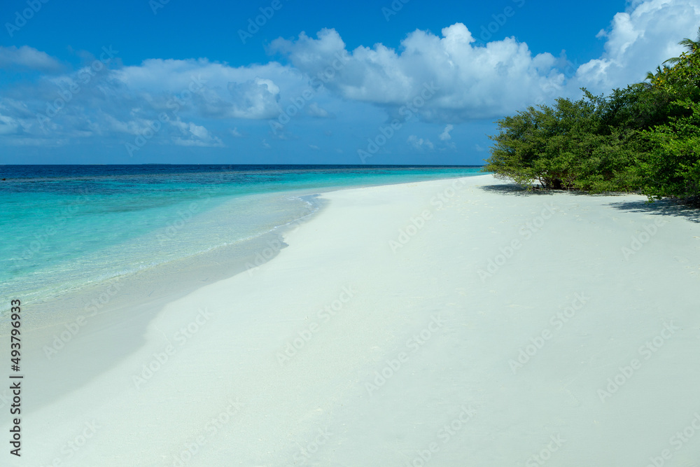 Maldives beach clear sand and sea water with blue sky