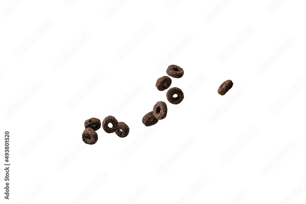 Chocolate rings cereal spill out into a bowl. Breakfast. Chocolate rings cereal spill out into a bowl. Breakfast.
