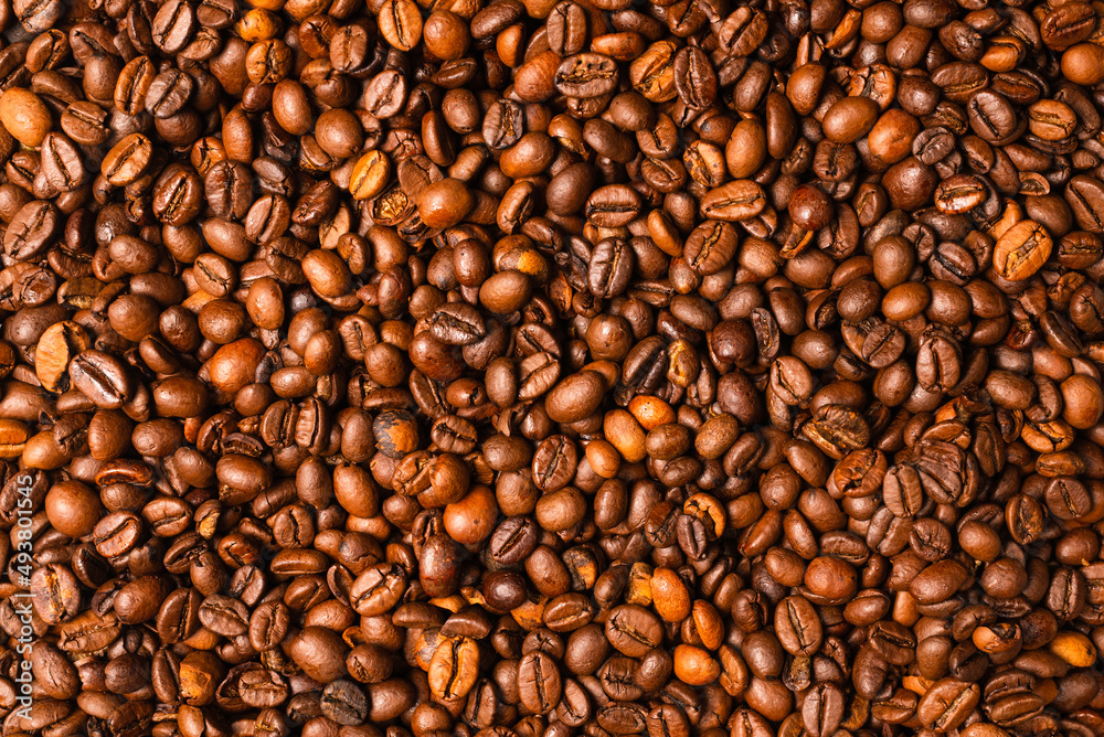 Coffee beans on a white background. Top view. Coffee beans on a white background. Top view.
