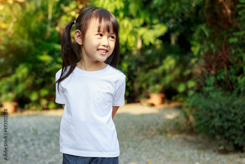 Portrait of cute girl with empty space of white t-shirt which good for mockup