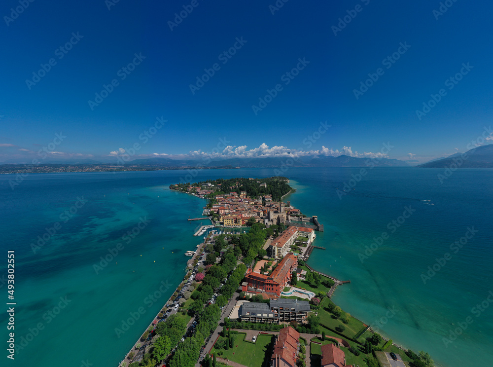 Rocca Scaligera Castle in Sirmione. View by Drone. Panoramic views of the city of Sirmione located on the shores of lake Garda, Italy