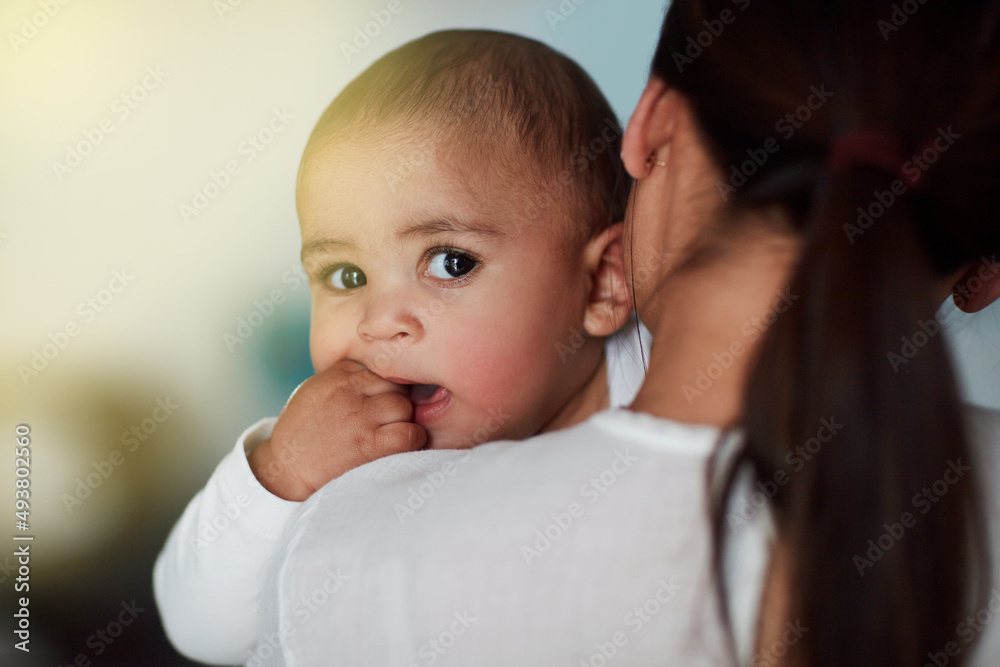 Hold my calls until Im done bonding with Mom. Shot of a loving mother carrying her baby boy at home.