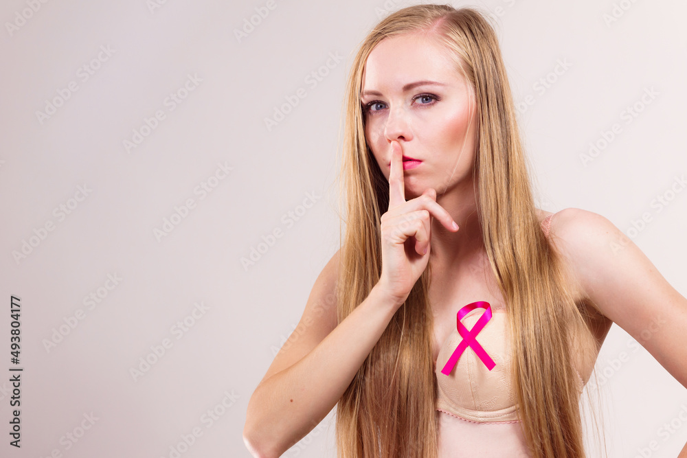Woman pink cancer ribbon on breast Woman pink cancer ribbon on breast