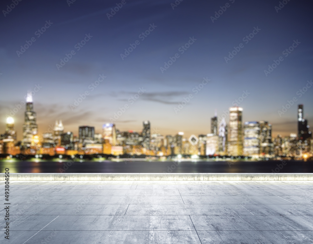 Empty concrete dirty seafront on the background of a beautiful blurry Chicago city skyline at night, mock up