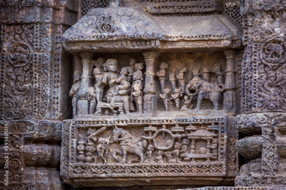 Figures of King and his consorts along with the royal court and elephant in the ruins of 800 year old Sun Temple Complex, Konark, India.  Unesco World Heritage  Site.