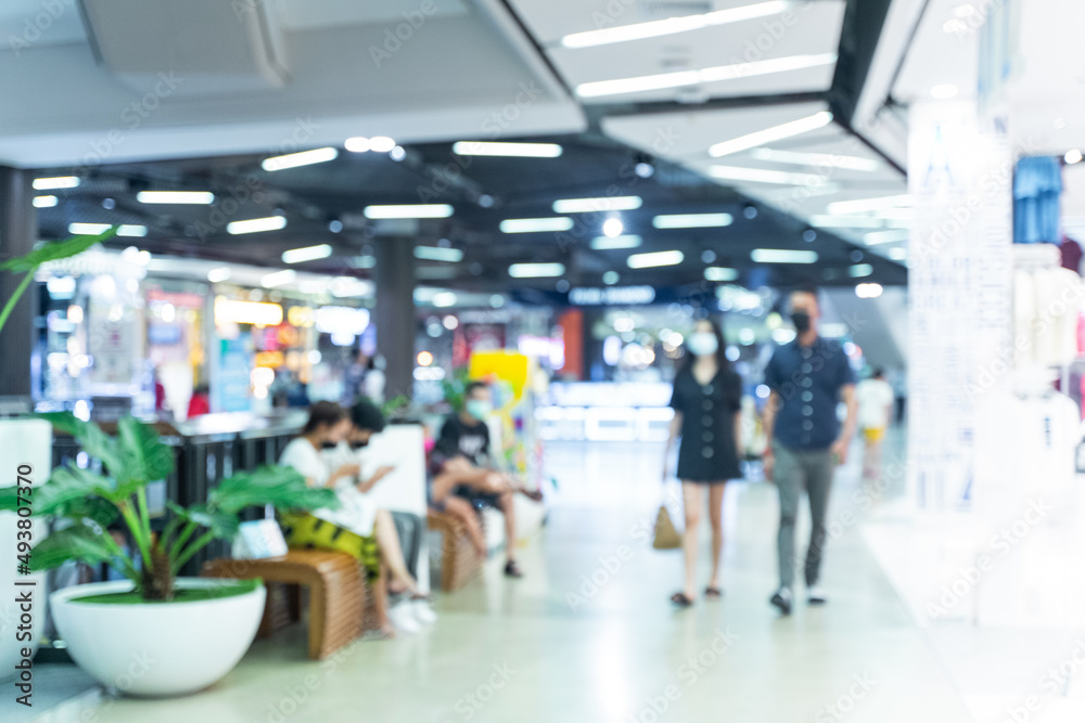 Blurred people walking in a shopping mall. Blurred people walking in a shopping mall.