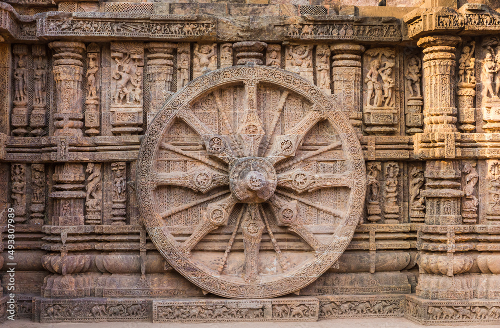 A stone wheel engraved in the walls of the 800 year old Sun Temple, Konark, India. The temple is designed as a chariot consisting of 24 such wheels.