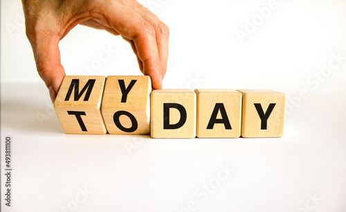 Today is my day symbol. Businessman turns wooden cubes and changes concept words Today to My day. Beautiful white table white background, copy space. Business, motivation today is my day concept.
